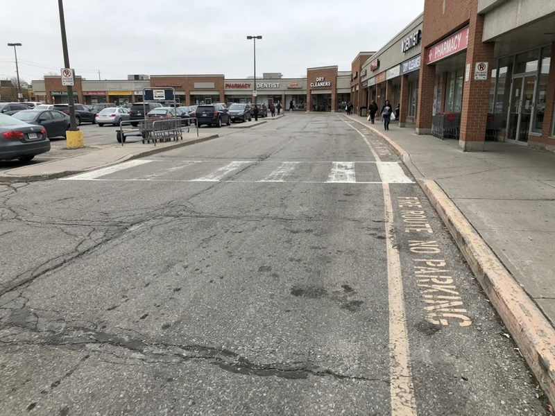 Before shopping plaza painting: faded lines in Toronto