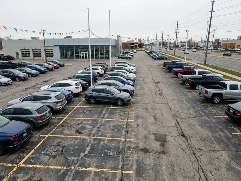 Before dealership lot painting: faded lines in Toronto