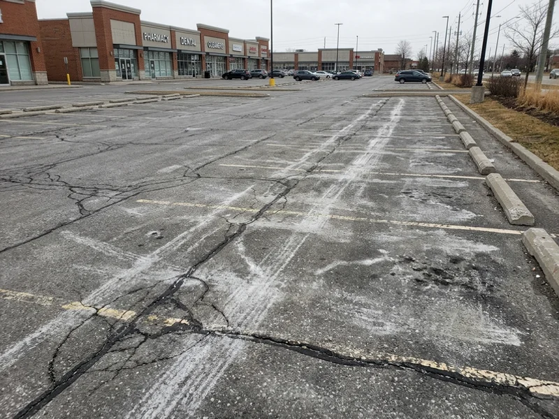 Before parking lot line painting: faded lines in Toronto