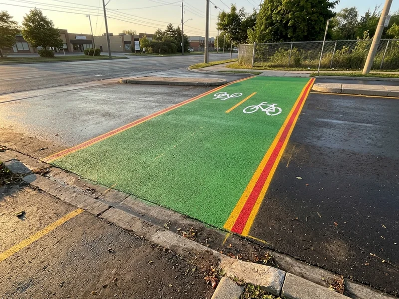 Green MMA conflict zone at a North York driveway crossing