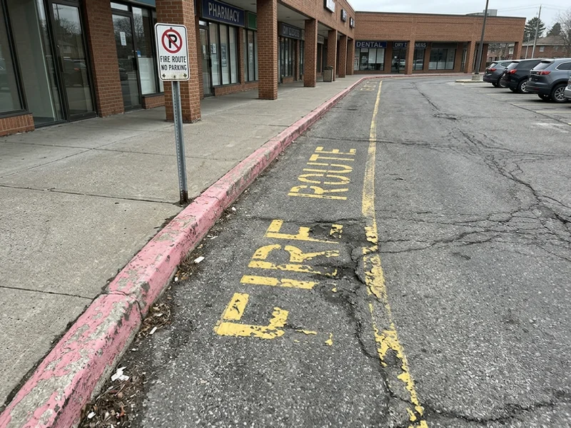 Fire route marking Toronto before: faded curb in Leaside