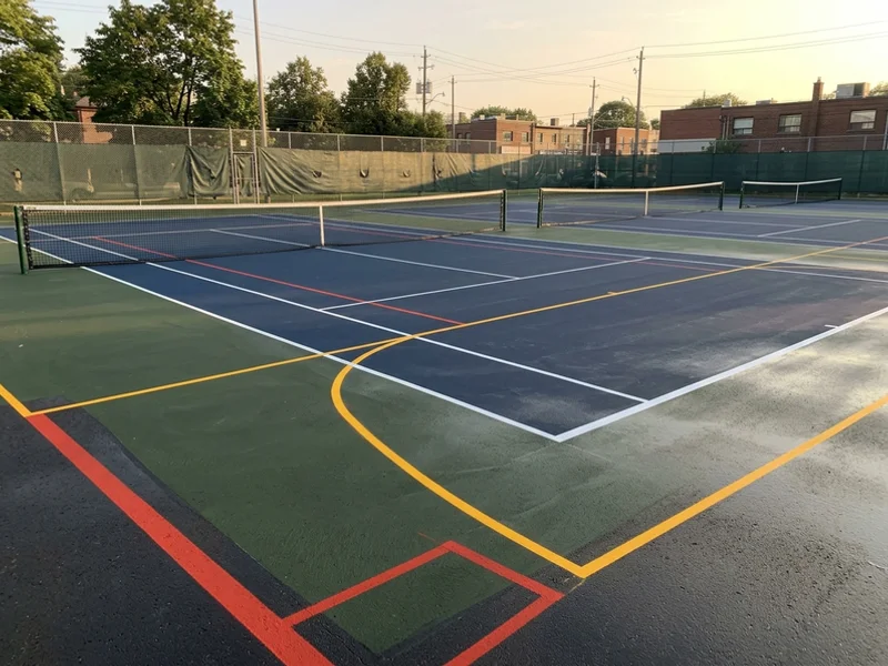 Three relined club tennis courts in Toronto