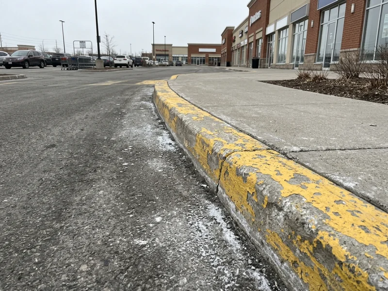 Before curb painting: faded lines in Toronto