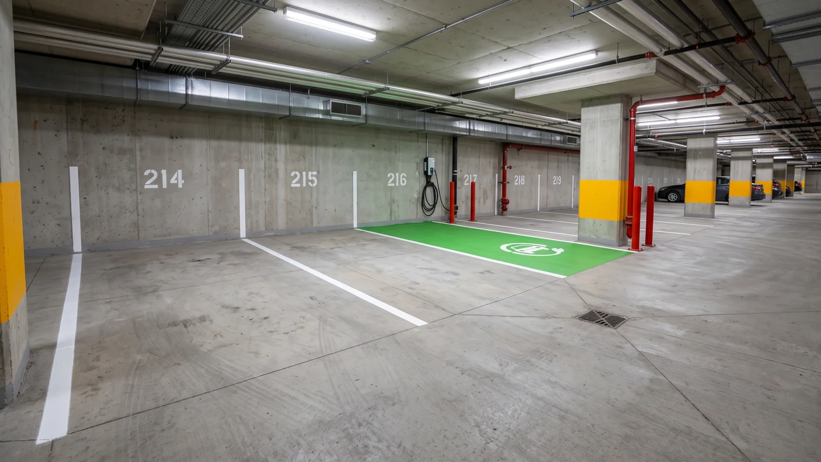 Condo line painting in Toronto: underground garage level with fresh stalls and an EV space