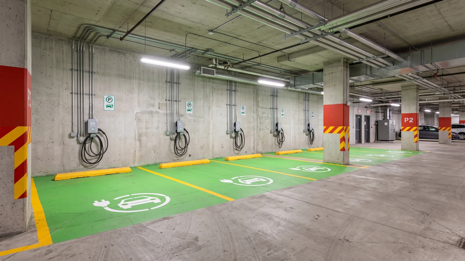 EV charging station markings in Toronto: green filled EV stalls with stencils